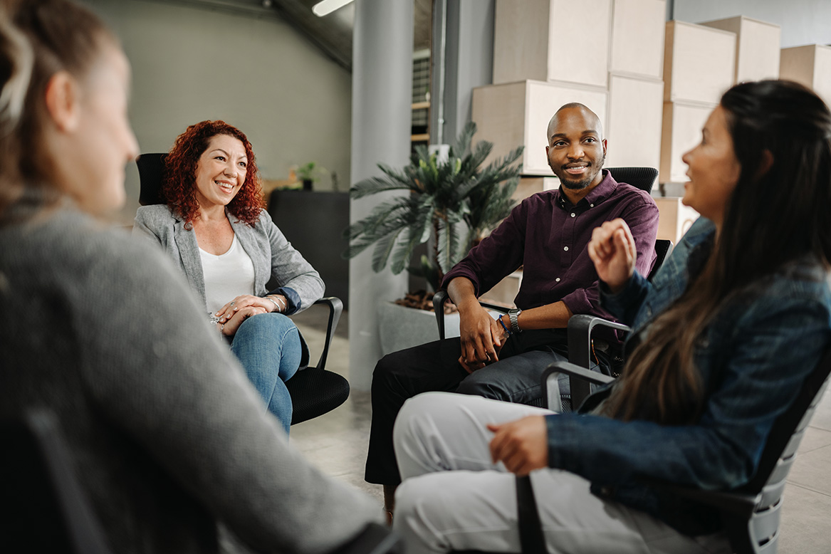 Team huddle in an office