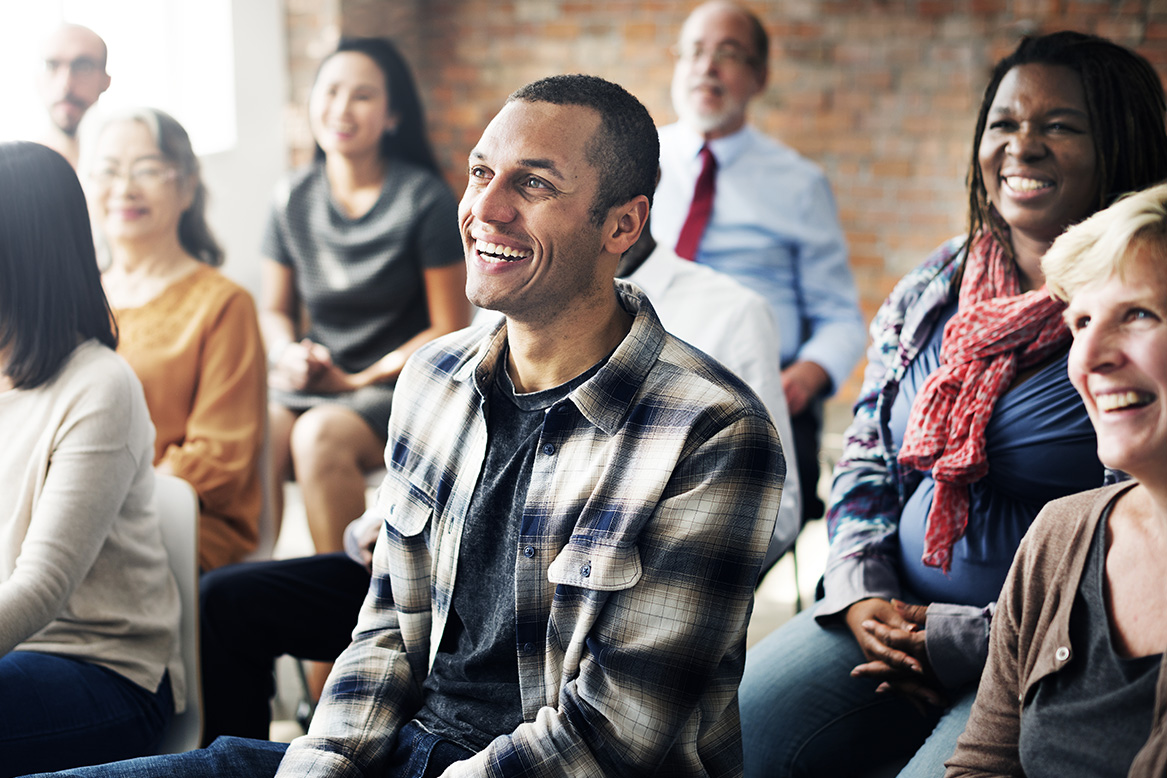 Excited employees at a company meeting
